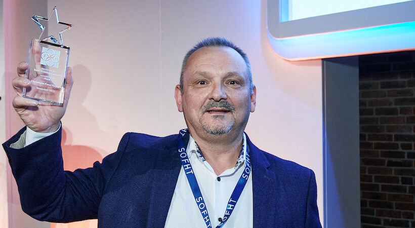 Martin Mann, Senior Customer Development Manager at Christeyns, collects the award.